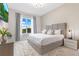 Bright bedroom with plush carpet, large window, and elegant decor for a cozy and stylish retreat at 7905 Jacks Club Dr, Kissimmee, FL 34747
