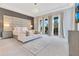 Bright bedroom with a comfortable seating area, large windows, and stylish decor for a luxurious experience at 7905 Jacks Club Dr, Kissimmee, FL 34747