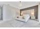 Spacious bedroom featuring a seating area, stylish lighting, and contemporary design for a luxurious feel at 7905 Jacks Club Dr, Kissimmee, FL 34747