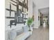 Bright foyer with soaring ceilings, modern art, and a view of the staircase at 7905 Jacks Club Dr, Kissimmee, FL 34747