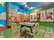 Bright, playful game room featuring a pool table, whimsical decor, and colorful Mario-themed accents at 7905 Jacks Club Dr, Kissimmee, FL 34747