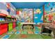 Whimsical Mario-themed game room with arcade games, a pool table, and playful decor for entertainment at 7905 Jacks Club Dr, Kissimmee, FL 34747