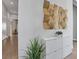 Hallway featuring modern decor, neutral color palette, and access to other rooms in the home at 7905 Jacks Club Dr, Kissimmee, FL 34747