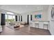 Bright, spacious living room with modern furniture, bar area, and large windows showcasing outdoor views at 7905 Jacks Club Dr, Kissimmee, FL 34747