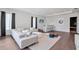 Expansive living area with modern furnishings, wet bar, and stylish decor, perfect for entertaining and relaxation at 7905 Jacks Club Dr, Kissimmee, FL 34747