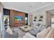 Cozy living room featuring elegant decor, a modern fireplace, and plush seating at 7905 Jacks Club Dr, Kissimmee, FL 34747