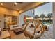 This elegant outdoor space includes a pool view, hanging chair, fire pit, and outdoor living and dining areas at 7905 Jacks Club Dr, Kissimmee, FL 34747