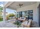 Inviting outdoor living space with a hanging chair, stylish seating, and a fire pit for cozy evenings at 7905 Jacks Club Dr, Kissimmee, FL 34747
