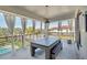 Outdoor entertaining space with dining table, comfortable seating and beautiful views, perfect for gatherings at 7905 Jacks Club Dr, Kissimmee, FL 34747