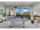 Entertaining patio with a pool table and comfortable seating, perfect for outdoor gatherings at 7905 Jacks Club Dr, Kissimmee, FL 34747