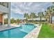 Stunning pool area with sun loungers, spa, and palm trees, ideal for outdoor enjoyment at 7905 Jacks Club Dr, Kissimmee, FL 34747