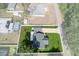 A beautiful aerial view of the house showing its well-manicured lawn and proximity to neighboring homes at 8717 Se 156Th St, Summerfield, FL 34491