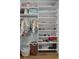 Bright closet features neatly arranged shelves and hanging rods filled with clothing and accessories at 8717 Se 156Th St, Summerfield, FL 34491