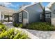 Paver walkway leads to a covered front porch of this charming single Gathering home at 8717 Se 156Th St, Summerfield, FL 34491