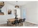 Cozy dining area featuring a rustic wooden table, comfortable seating, modern decor, and pendant lighting fixture at 8848 Bismarck Palm Dr, Winter Garden, FL 34787