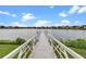 Picturesque dock with views of the lake and surrounding homes at 8848 Bismarck Palm Dr, Winter Garden, FL 34787