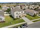 An aerial of a lovely two-story home featuring a well-maintained lawn in a quiet neighborhood at 889 Boxelder Ave, Minneola, FL 34715