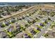 Aerial view of suburban neighborhood with well-maintained lawns and houses at 889 Boxelder Ave, Minneola, FL 34715