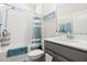 Bathroom featuring a shower, vanity, and modern decor at 889 Boxelder Ave, Minneola, FL 34715