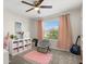 Bedroom features a comfortable chair, guitar, and shelving unit at 889 Boxelder Ave, Minneola, FL 34715
