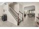 Spacious foyer showcasing a staircase and an open floor plan, leading to the living areas at 889 Boxelder Ave, Minneola, FL 34715