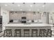 Spacious kitchen island with pendant lighting and seating for five at 889 Boxelder Ave, Minneola, FL 34715
