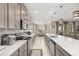 Modern kitchen with stainless steel appliances and sleek countertops at 889 Boxelder Ave, Minneola, FL 34715