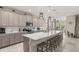 Kitchen featuring a large island, stainless steel appliances, and pendant lighting at 889 Boxelder Ave, Minneola, FL 34715