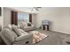 Inviting upstairs living room with soft carpeting, ceiling fan, reclining white sofas and TV at 889 Boxelder Ave, Minneola, FL 34715