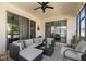 Enclosed patio with comfortable outdoor seating and view of backyard at 889 Boxelder Ave, Minneola, FL 34715