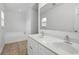 Bathroom featuring a double vanity and separate soaking tub at 905 Cascade Falls Ln, Deland, FL 32720