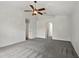Large bedroom with carpet flooring, ceiling fan and arched doorway at 905 Cascade Falls Ln, Deland, FL 32720