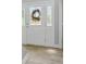 Bright entryway featuring tile floors and sidelights allowing ample natural light at 905 Cascade Falls Ln, Deland, FL 32720