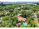 Overhead shot displays the home, landscaped yard, and outdoor spaces in a mature residential setting at 906 Alhambra Ct, Orlando, FL 32804