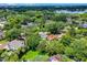 Aerial view with location pin shows property located in an established, lush neighborhood near a lake at 906 Alhambra Ct, Orlando, FL 32804