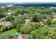 Aerial view shows the property nestled in a green neighborhood close to the city at 906 Alhambra Ct, Orlando, FL 32804