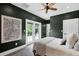 Well-lit bedroom featuring a door to the backyard with an ensuite bathroom at 906 Alhambra Ct, Orlando, FL 32804