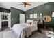 Stylish bedroom with an ensuite bathroom, decorative lighting, and ceiling fan at 906 Alhambra Ct, Orlando, FL 32804