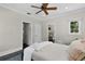 Bedroom featuring a ceiling fan, natural lighting, neutral color scheme, and two closets at 906 Alhambra Ct, Orlando, FL 32804