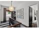 Bright hallway with gallery wall, dark accents, and pendant lighting at 906 Alhambra Ct, Orlando, FL 32804
