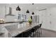 Kitchen featuring stainless steel appliances, ample white cabinetry and a large center island with bar stool seating at 906 Alhambra Ct, Orlando, FL 32804