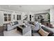 Cozy living room featuring a large sectional sofa and an open layout into the kitchen at 906 Alhambra Ct, Orlando, FL 32804