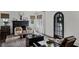 Elegant living room with fireplace, dark wood floors, and a large decorative deer head at 906 Alhambra Ct, Orlando, FL 32804