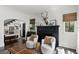 Stylish living room with fireplace, hardwood floors, and decoratively adorned black mantle at 906 Alhambra Ct, Orlando, FL 32804