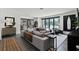 Bright living room featuring a comfortable sectional sofa and access to an outdoor area at 906 Alhambra Ct, Orlando, FL 32804
