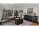 Spacious living room with hardwood floors, accent cabinet, and archway leading to other rooms at 906 Alhambra Ct, Orlando, FL 32804