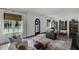 Comfortable living room featuring bright windows, hardwood floors, and neutral colors at 906 Alhambra Ct, Orlando, FL 32804