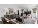 Cozy living room featuring dark hardwood floors, black accents, and an archway entryway at 906 Alhambra Ct, Orlando, FL 32804