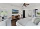Bedroom featuring modern decor, a ceiling fan, and hardwood flooring at 906 Alhambra Ct, Orlando, FL 32804