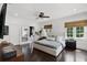 Bright main bedroom with platform bed, dark floors, and natural light at 906 Alhambra Ct, Orlando, FL 32804